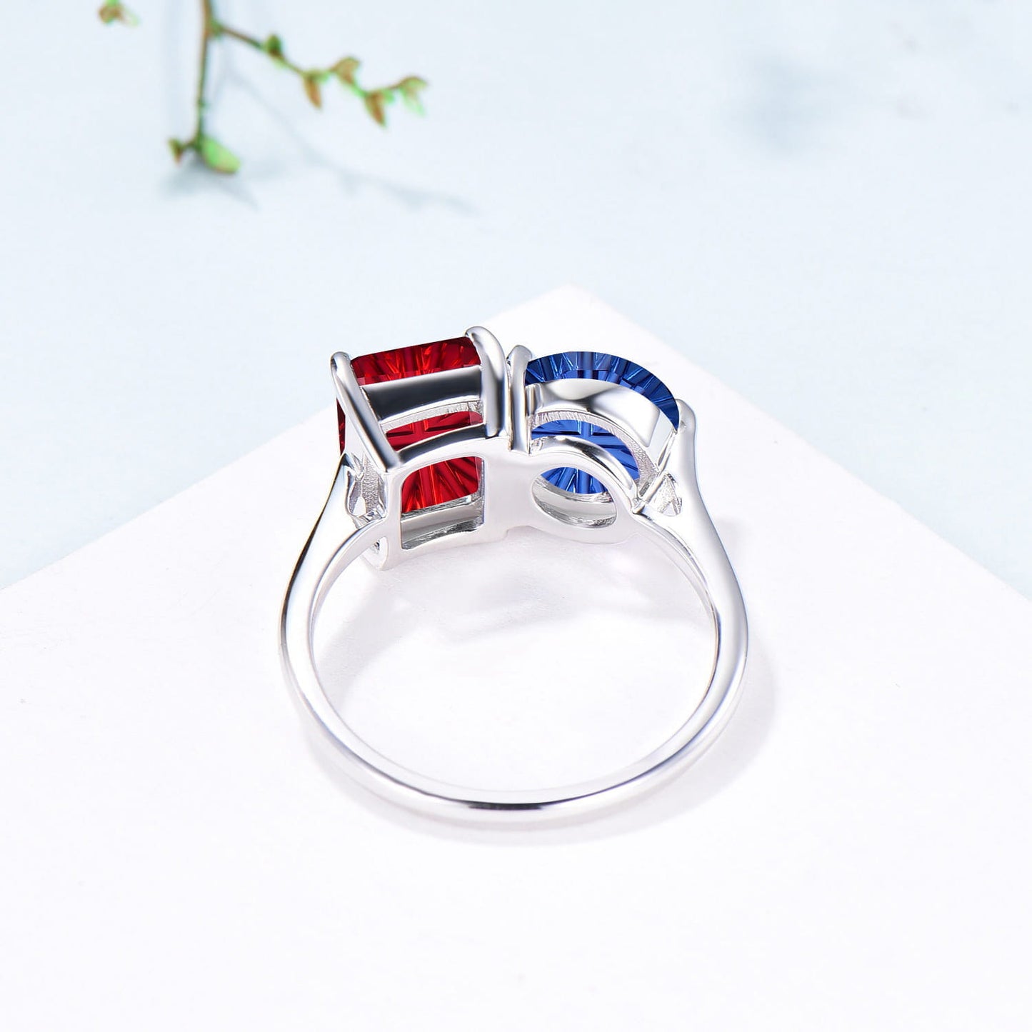 You and Me | Starburst Emerald Cut Blue Sapphire and Round Red Ruby Toi et Moi Engagement Ring