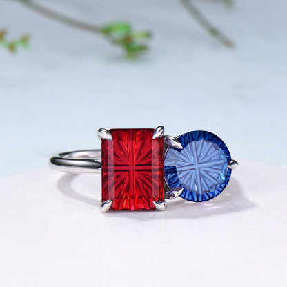 You and Me | Starburst Emerald Cut Blue Sapphire and Round Red Ruby Toi et Moi Engagement Ring