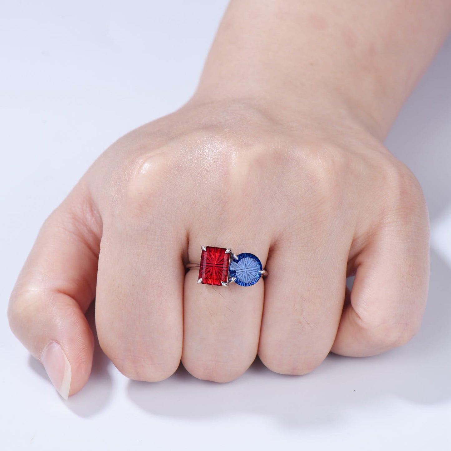 You and Me | Starburst Emerald Cut Blue Sapphire and Round Red Ruby Toi et Moi Engagement Ring