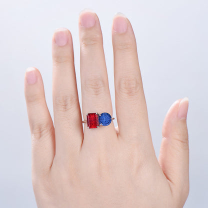 You and Me | Starburst Emerald Cut Blue Sapphire and Round Red Ruby Toi et Moi Engagement Ring