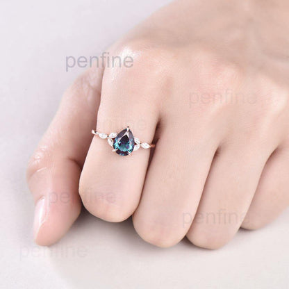 pear shaped alexandrite engagement ring hand